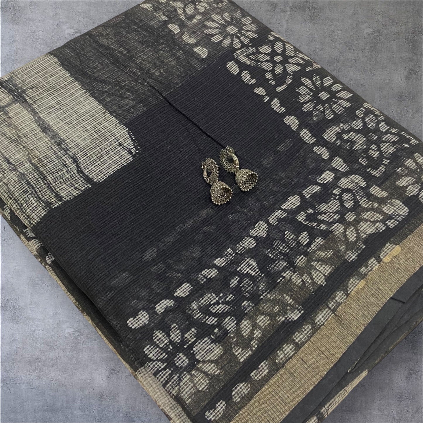 Black and white cotton kota doria with floral zari border saree