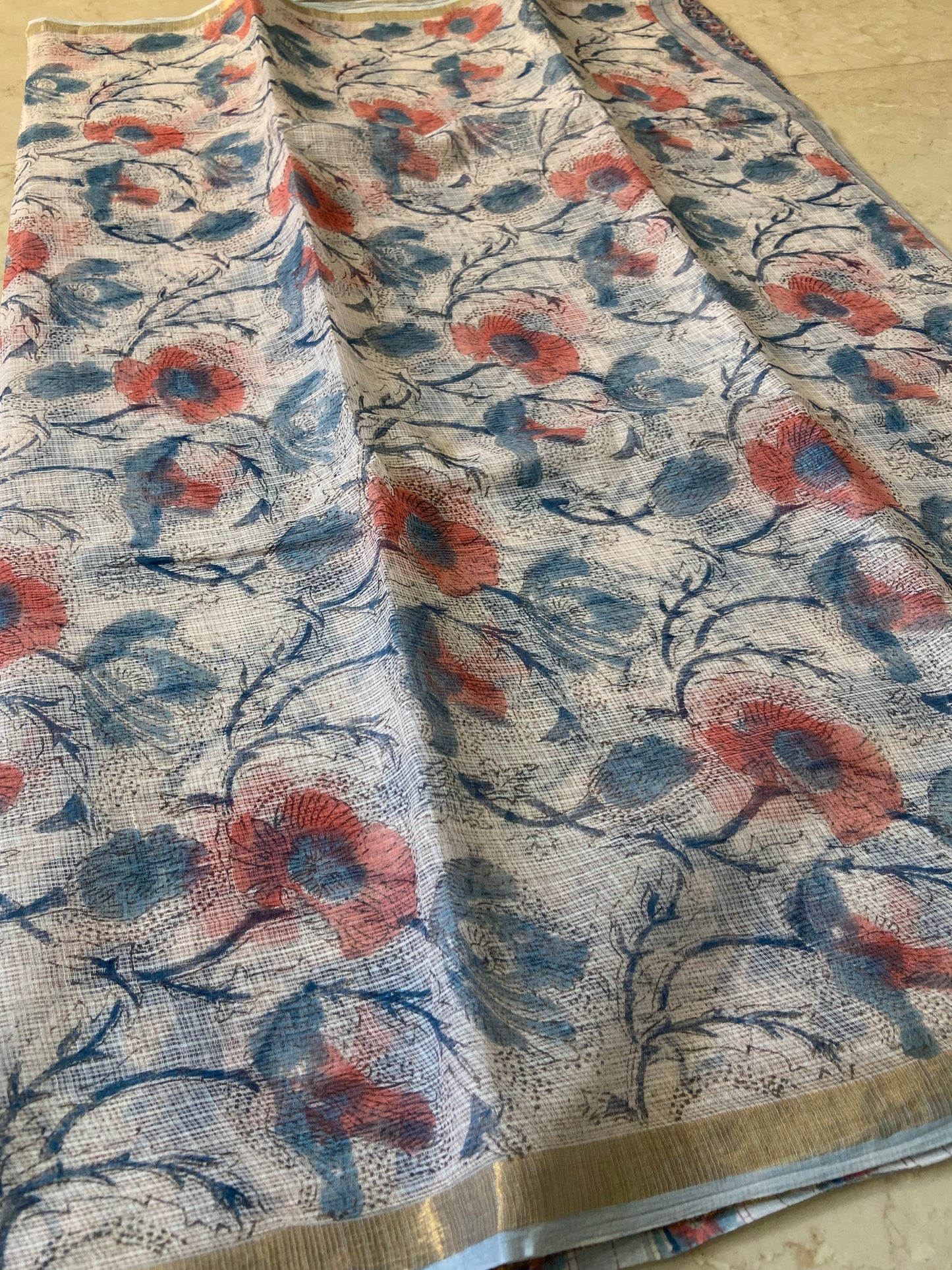 Blue and red flower buttis cotton kota doria zari border saree
