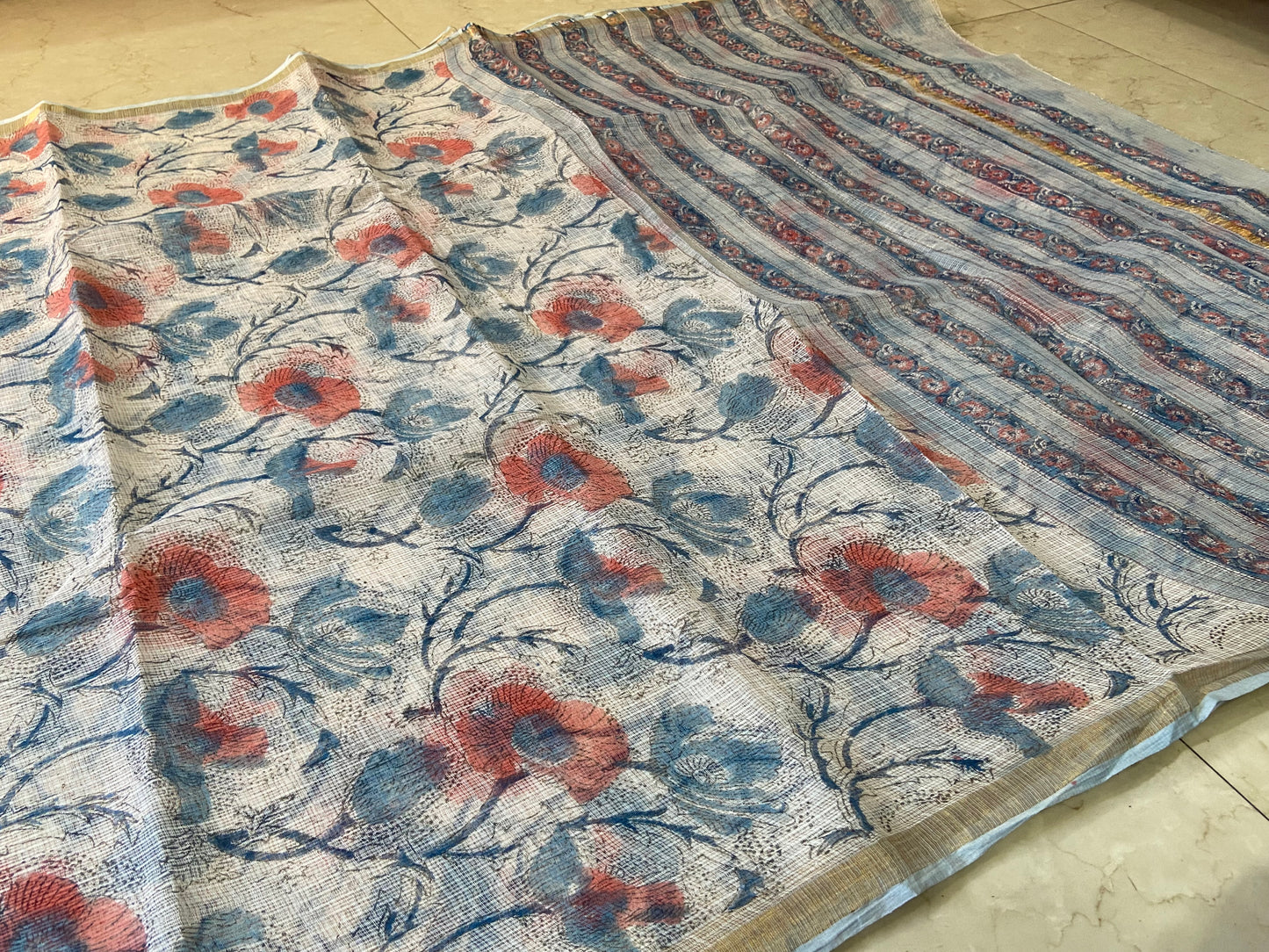 Blue and red flower buttis cotton kota doria zari border saree
