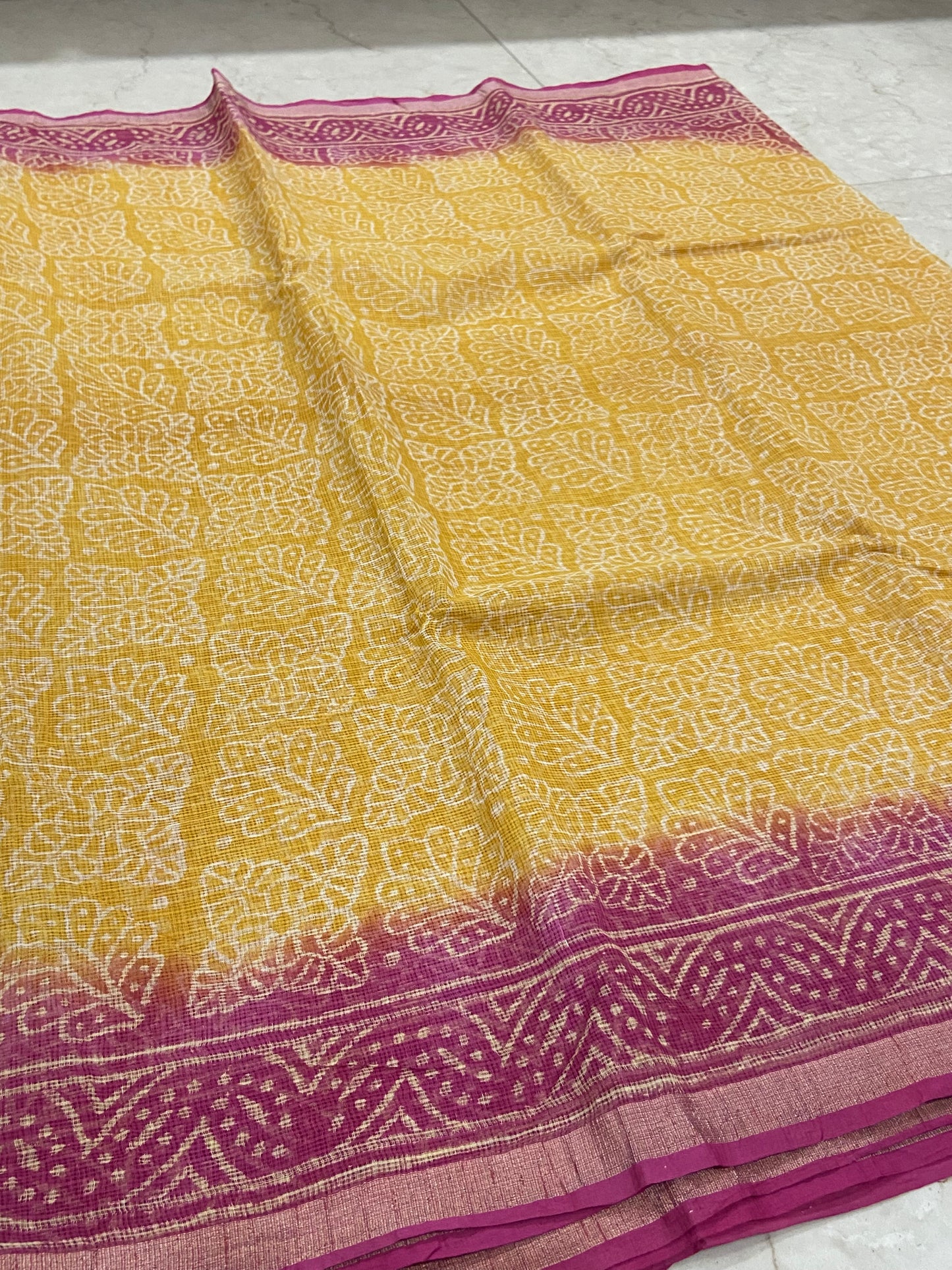 Yellow and pink handblock printed cotton kota doria saree